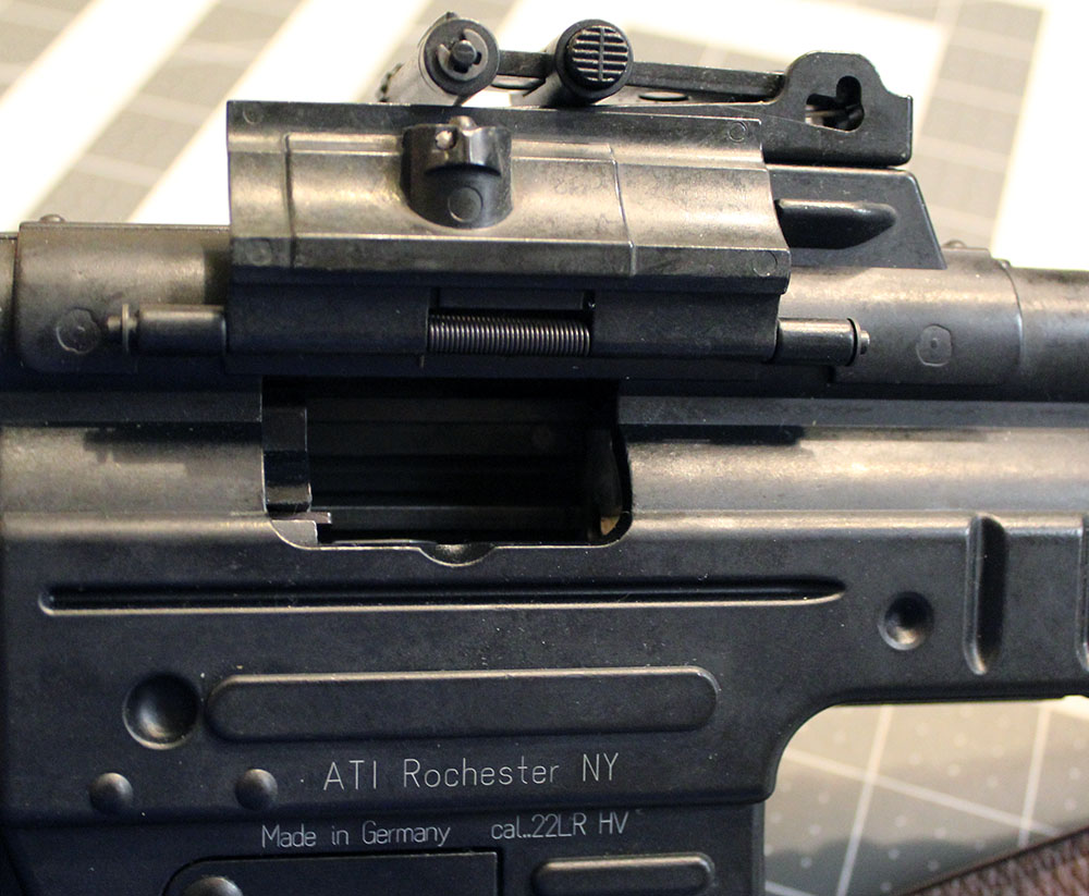 same view, bolt slightly forward in charging handle locked position