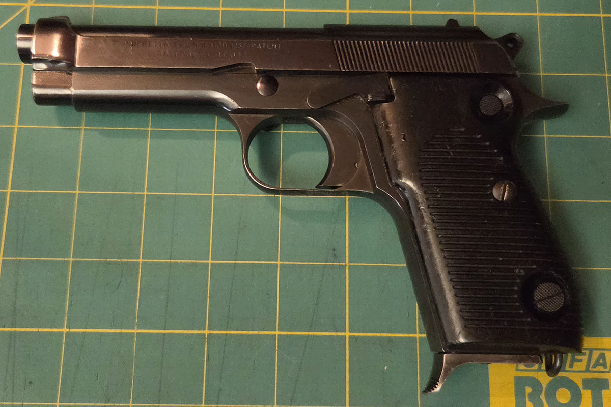 A Beretta 951 pistol, left side