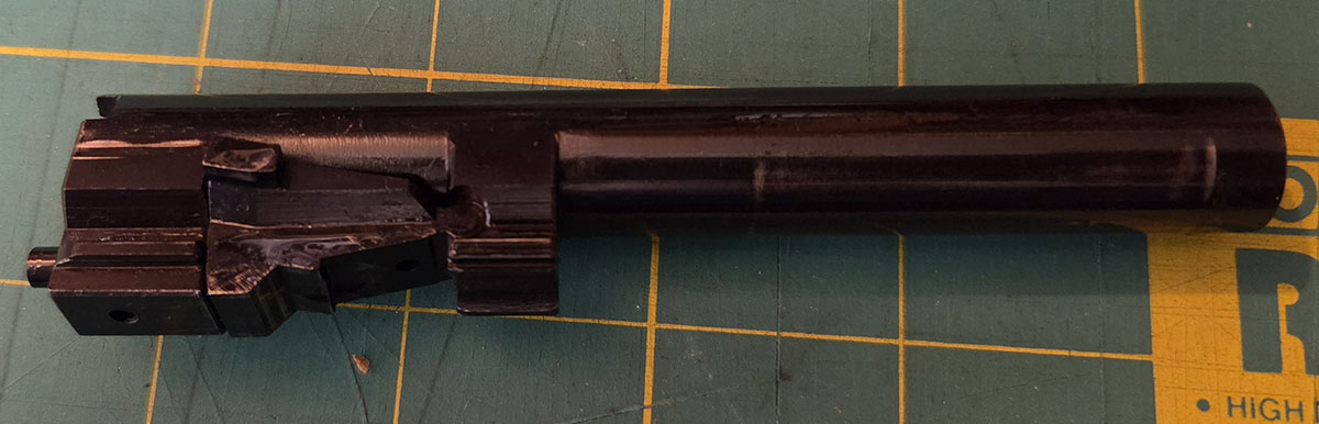 detail of the locking block and barrel of a Beretta 951, with the lock in the up position